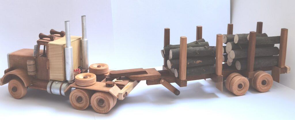 Peterbilt semi truck model with logging trailer